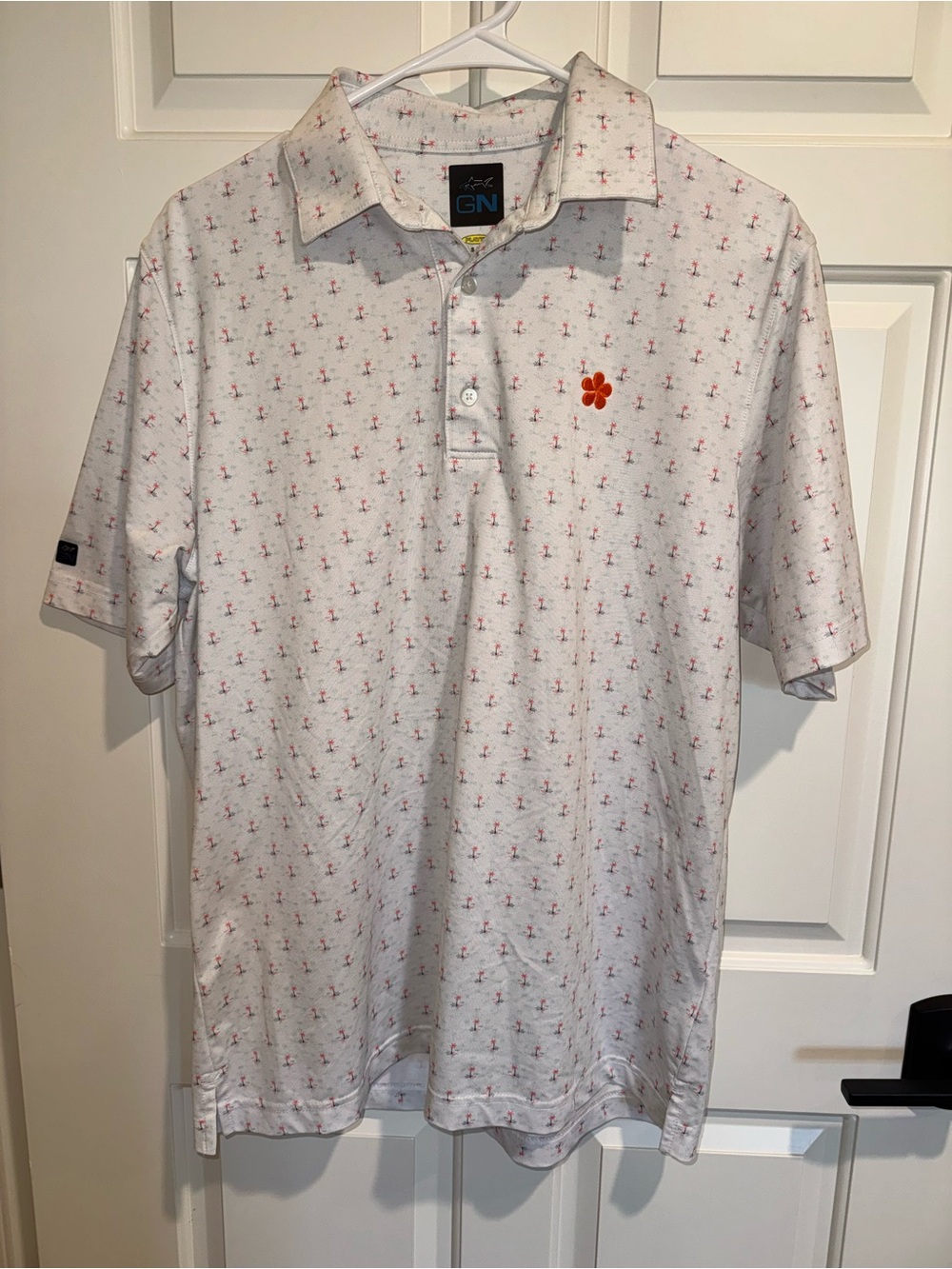 Greg Norman Collection White Performance Polo with orange palm tree Motif Small